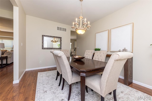 602 Whispering Willows Ct, Ballwin, MO 63021 - dining space with a chandelier and wood finished floors
