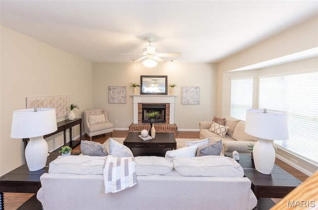 602 Whispering Willows Ct, Ballwin, MO 63021 - living area with wood finished floors, a ceiling fan, and a fireplace