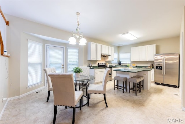 602 Whispering Willows Ct, Ballwin, MO 63021 - dining area with a chandelier and baseboards