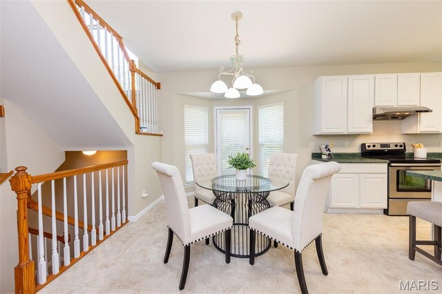 602 Whispering Willows Ct, Ballwin, MO 63021 - dining room featuring a chandelier and baseboards