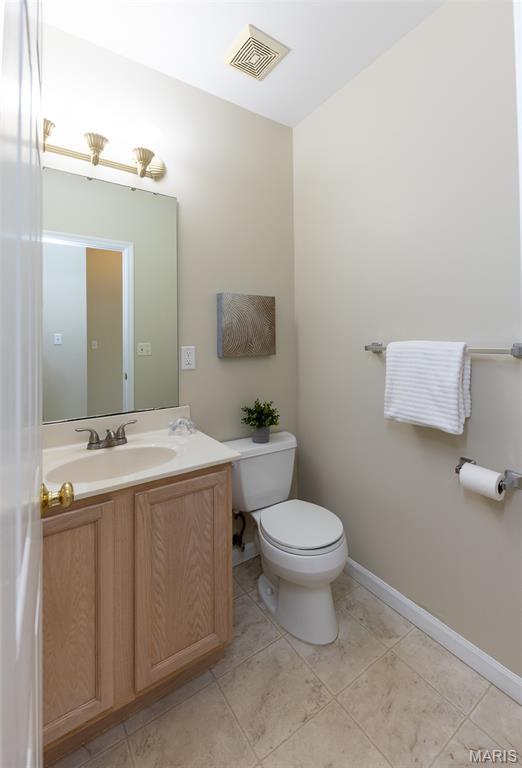 602 Whispering Willows Ct, Ballwin, MO 63021 - half bathroom featuring vanity and tile patterned flooring