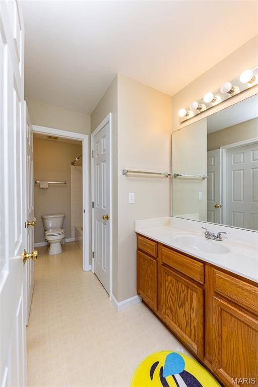 602 Whispering Willows Ct, Ballwin, MO 63021 - full bathroom featuring vanity, tile patterned floors, and bathtub / shower combination