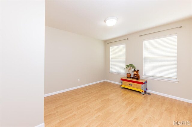602 Whispering Willows Ct, Ballwin, MO 63021 - empty room featuring light wood-style flooring and baseboards