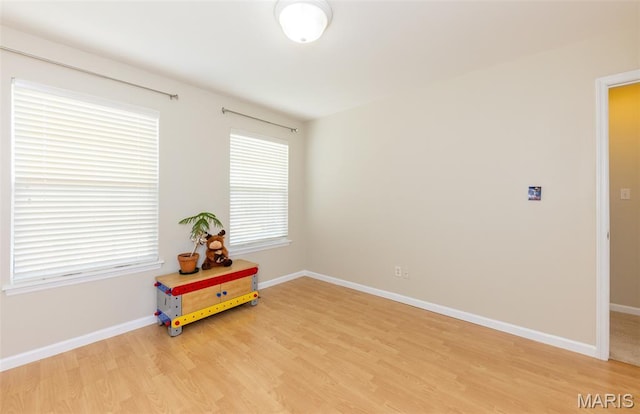 602 Whispering Willows Ct, Ballwin, MO 63021 - spare room featuring light wood-style flooring and baseboards