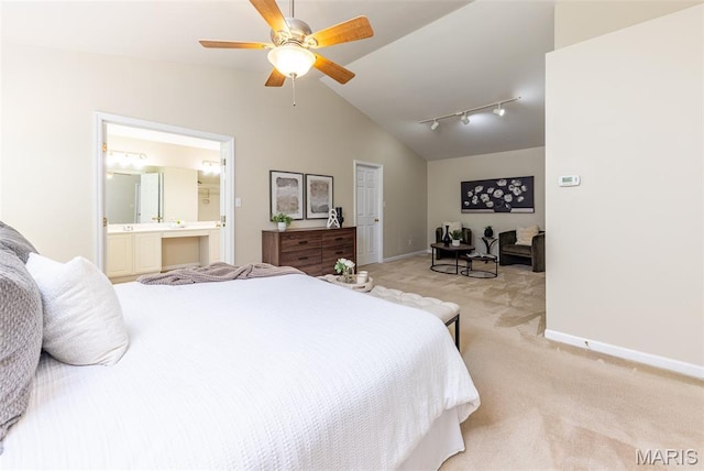 602 Whispering Willows Ct, Ballwin, MO 63021 - bedroom with light colored carpet, vaulted ceiling, connected bathroom, rail lighting, and ceiling fan