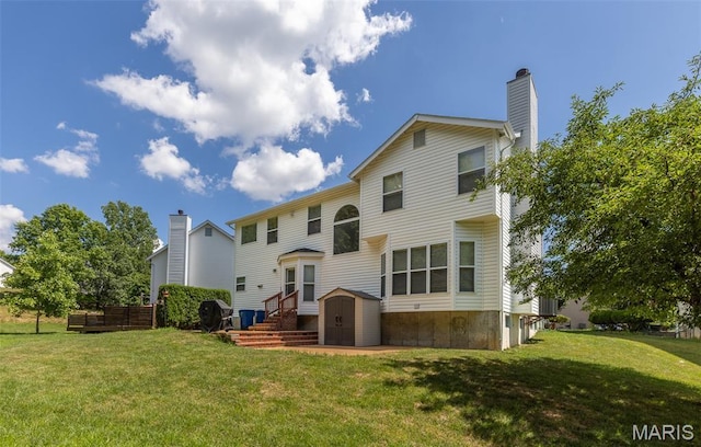 602 Whispering Willows Ct, Ballwin, MO 63021 - rear view of property with a storage unit, a lawn, and a chimney