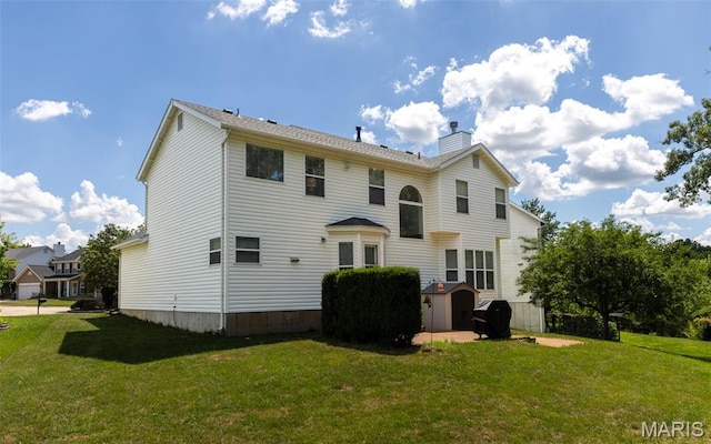 602 Whispering Willows Ct, Ballwin, MO 63021 - rear view of house with a yard and a chimney