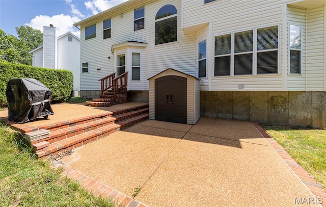 602 Whispering Willows Ct, Ballwin, MO 63021 - rear view of property featuring a patio and a shed