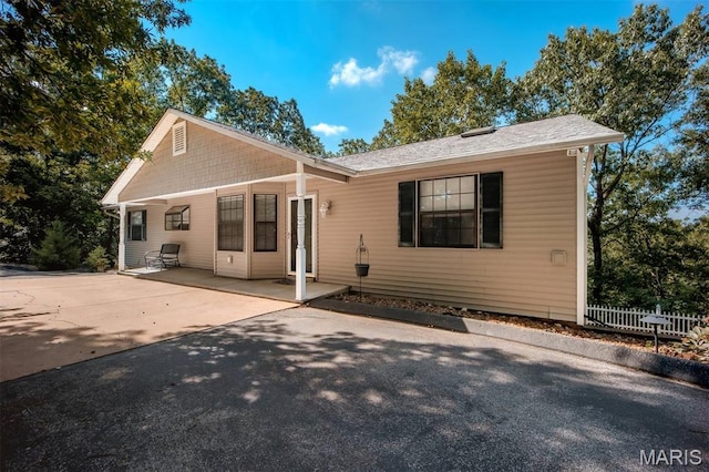 7040 Oak Shadow Ln, High Ridge, MO 63049 - view of front of home with a patio area