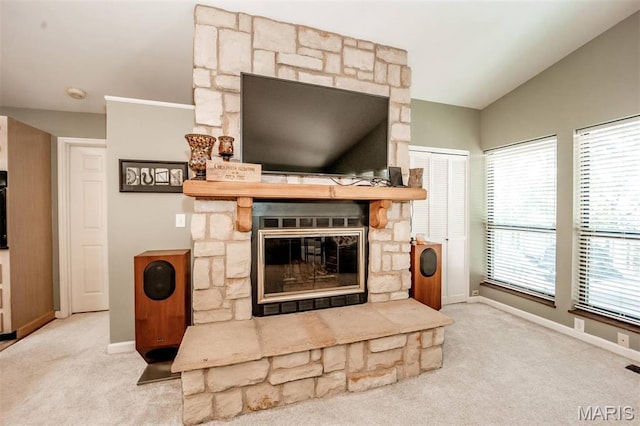 7040 Oak Shadow Ln, High Ridge, MO 63049 - carpeted living room with healthy amount of natural light, vaulted ceiling, and a fireplace