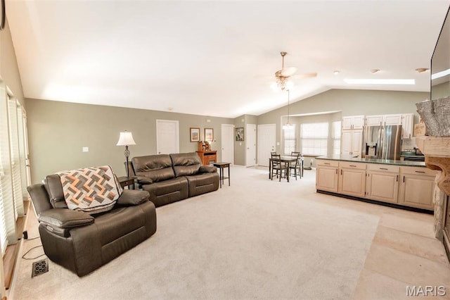 7040 Oak Shadow Ln, High Ridge, MO 63049 - living area with a ceiling fan, vaulted ceiling, and light colored carpet