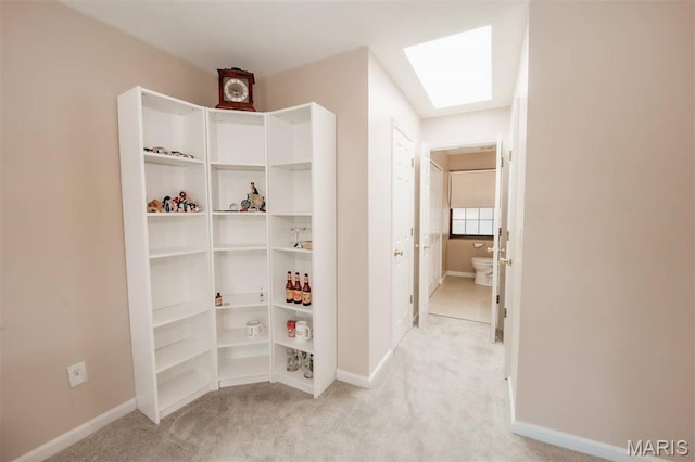 7040 Oak Shadow Ln, High Ridge, MO 63049 - hallway with light carpet and a skylight
