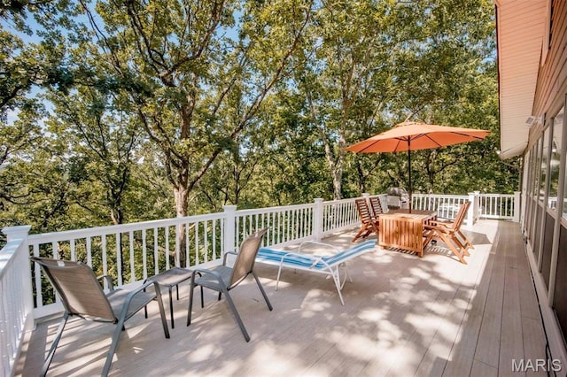 7040 Oak Shadow Ln, High Ridge, MO 63049 - wooden terrace with outdoor dining area and view of scattered trees