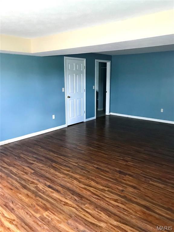 1462 Windle Rd, Cuba, MO 65453 - empty room featuring baseboards and dark wood-type flooring