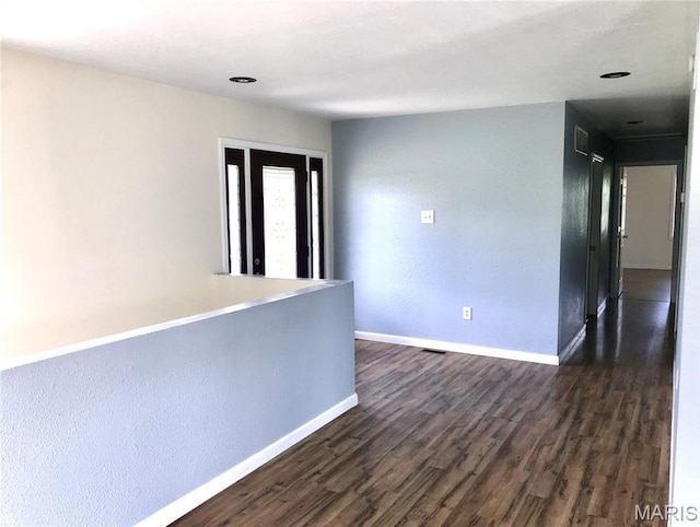 1462 Windle Rd, Cuba, MO 65453 - unfurnished room featuring baseboards and dark wood-style flooring