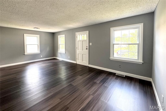 4404 Saint Leo Ln, Saint Ann, MO 63074 - entrance foyer featuring dark wood-type flooring and a textured ceiling