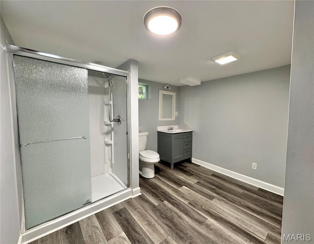 4404 Saint Leo Ln, Saint Ann, MO 63074 - bathroom with vanity, a stall shower, and wood finished floors