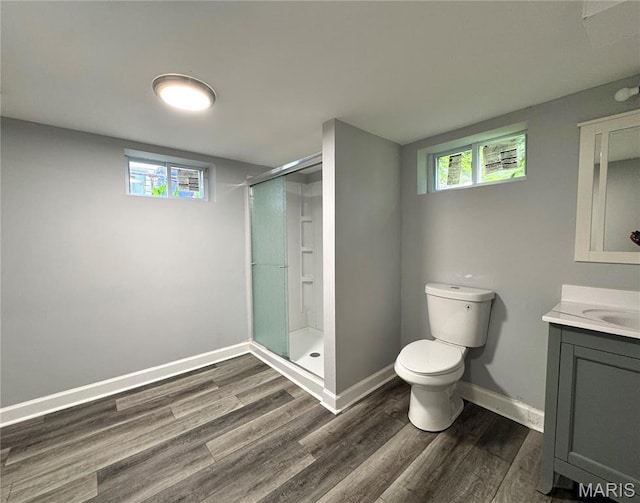 4404 Saint Leo Ln, Saint Ann, MO 63074 - bathroom featuring vanity, wood finished floors, and a shower stall