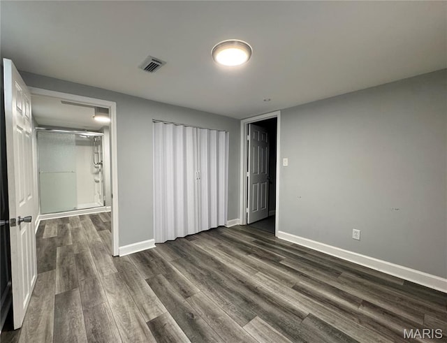 4404 Saint Leo Ln, Saint Ann, MO 63074 - unfurnished bedroom with dark wood-style flooring and baseboards