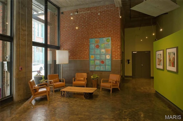 1010 Saint Charles St Unit 802, Saint Louis, MO 63101 - building lobby featuring a towering ceiling and brick wall