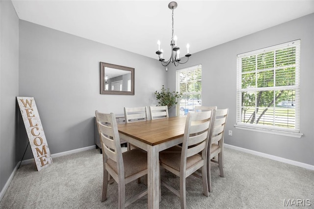 2330 Eagle Pines Dr, Saint Charles, MO 63303 - dining area featuring a chandelier and light colored carpet
