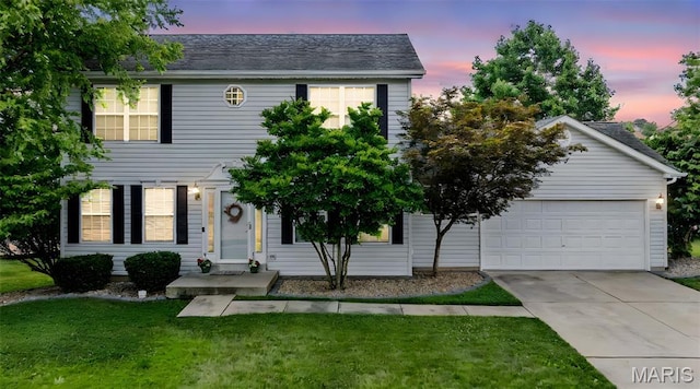 2330 Eagle Pines Dr, Saint Charles, MO 63303 - colonial inspired home with a front yard, concrete driveway, and a garage