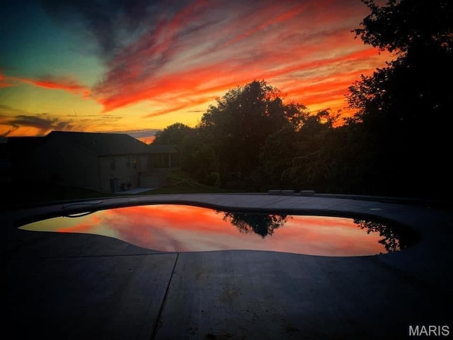 2803 Poolbrook Way, Washington, MO 63090 - pool at dusk with a patio and an outdoor pool
