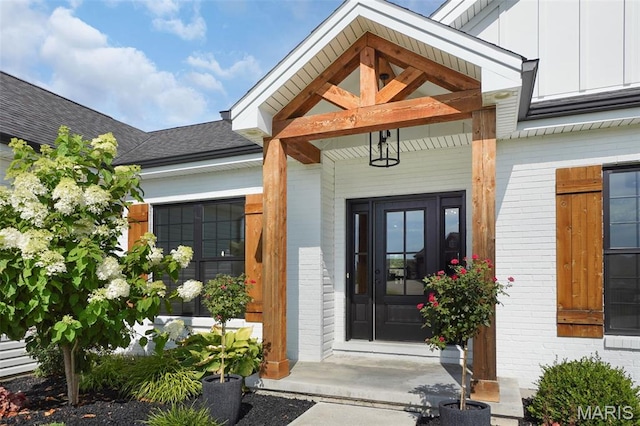 2803 Poolbrook Way, Washington, MO 63090 - property entrance featuring brick siding, board and batten siding, and roof with shingles
