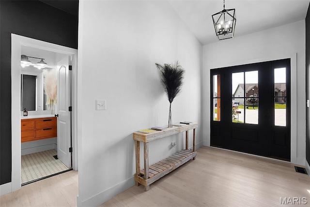 2803 Poolbrook Way, Washington, MO 63090 - entrance foyer with light wood finished floors and a chandelier
