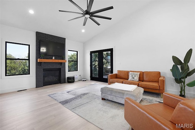 2803 Poolbrook Way, Washington, MO 63090 - living room with a brick fireplace, wood finished floors, french doors, recessed lighting, and a ceiling fan