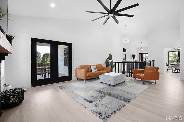 2803 Poolbrook Way, Washington, MO 63090 - living room with wood finished floors, a ceiling fan, a high ceiling, french doors, and recessed lighting