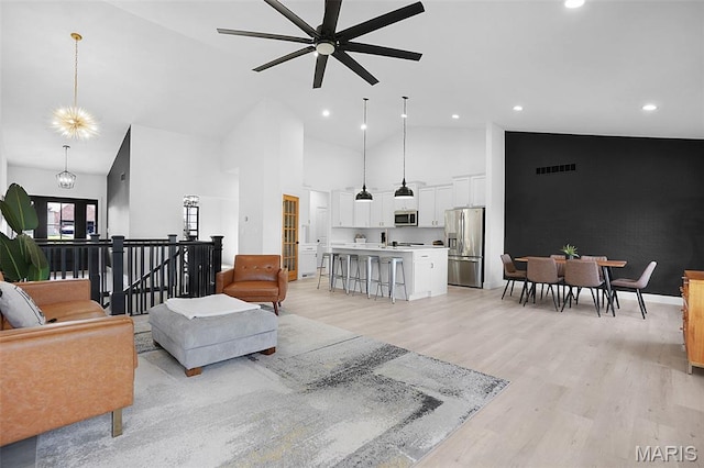 2803 Poolbrook Way, Washington, MO 63090 - living room featuring ceiling fan, high vaulted ceiling, light wood-type flooring, and recessed lighting