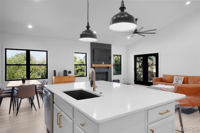 2803 Poolbrook Way, Washington, MO 63090 - kitchen with open floor plan, a brick fireplace, light countertops, recessed lighting, and stainless steel dishwasher