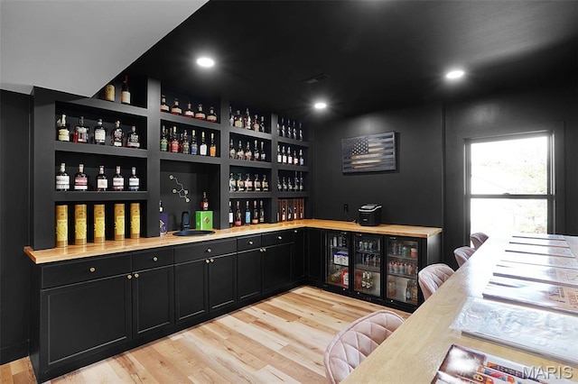 2803 Poolbrook Way, Washington, MO 63090 - indoor wet bar with light wood-type flooring