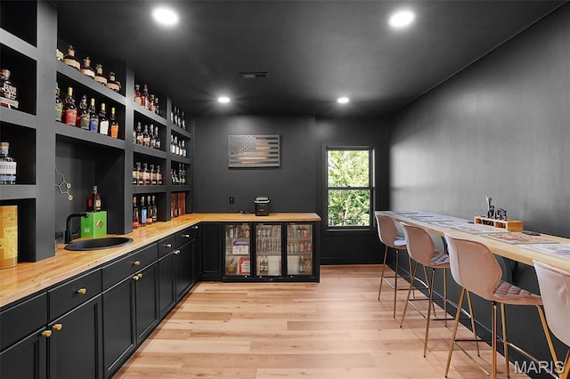 2803 Poolbrook Way, Washington, MO 63090 - indoor wet bar with light wood-style floors and recessed lighting