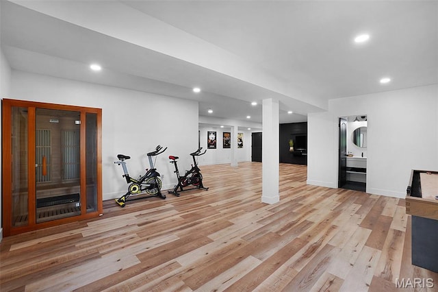2803 Poolbrook Way, Washington, MO 63090 - exercise room featuring light wood-style flooring and recessed lighting
