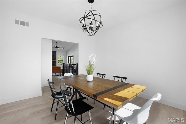 2803 Poolbrook Way, Washington, MO 63090 - dining area featuring a chandelier, light wood finished floors, and ceiling fan