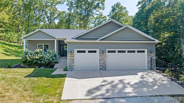 5065 Fox Bridge Rd, Wildwood, MO 63069 - view of front of property with an attached garage, driveway, a front lawn, stone siding, and covered porch