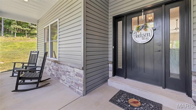 5065 Fox Bridge Rd, Wildwood, MO 63069 - entrance to property with covered porch and a yard