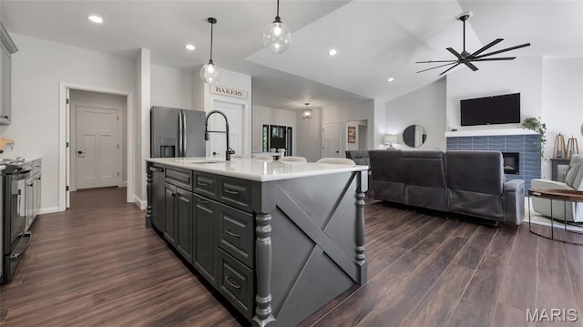 5065 Fox Bridge Rd, Wildwood, MO 63069 - kitchen with dark wood finished floors, lofted ceiling, light countertops, open floor plan, and ceiling fan
