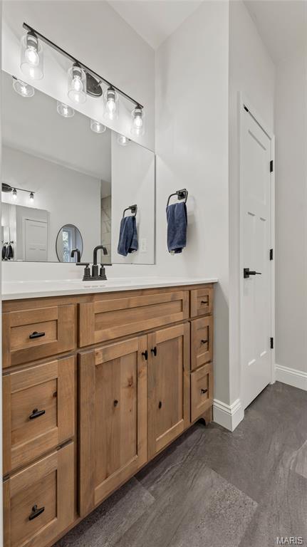 5065 Fox Bridge Rd, Wildwood, MO 63069 - bathroom with vanity and baseboards