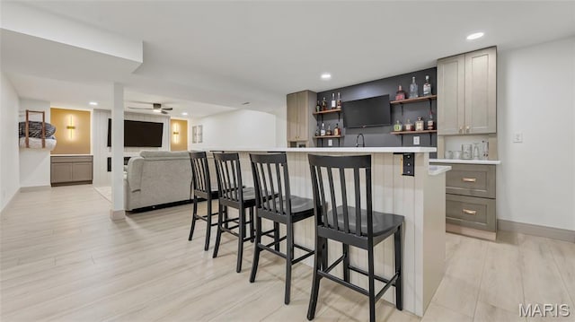 5065 Fox Bridge Rd, Wildwood, MO 63069 - indoor wet bar featuring light wood finished floors, recessed lighting, and a ceiling fan