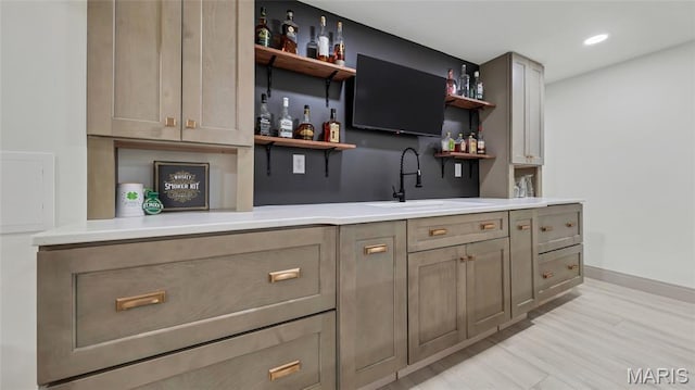 5065 Fox Bridge Rd, Wildwood, MO 63069 - indoor wet bar with light wood-style flooring and recessed lighting