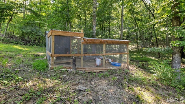 5065 Fox Bridge Rd, Wildwood, MO 63069 - view of poultry coop featuring a wooded view