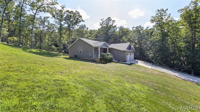 5065 Fox Bridge Rd, Wildwood, MO 63069 - view of front of house featuring concrete driveway, a garage, and a front yard