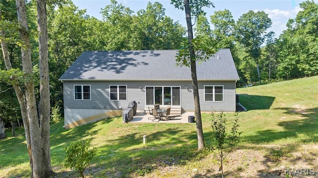 5065 Fox Bridge Rd, Wildwood, MO 63069 - rear view of property with a yard, a patio area, and roof with shingles