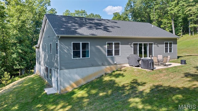 5065 Fox Bridge Rd, Wildwood, MO 63069 - back of house with a lawn, a patio area, and a shingled roof