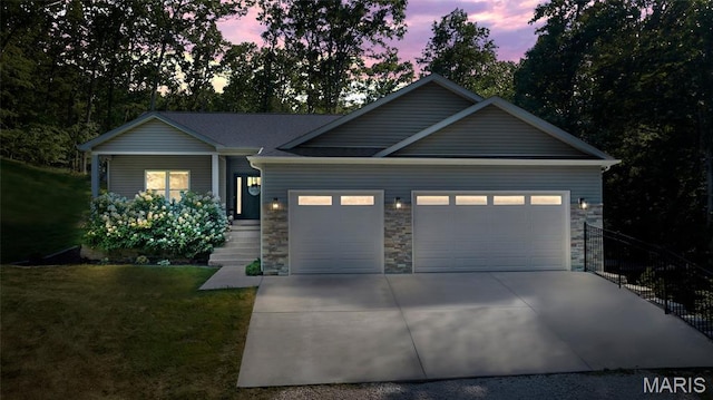 5065 Fox Bridge Rd, Wildwood, MO 63069 - view of front of property featuring an attached garage, driveway, a lawn, stone siding, and covered porch