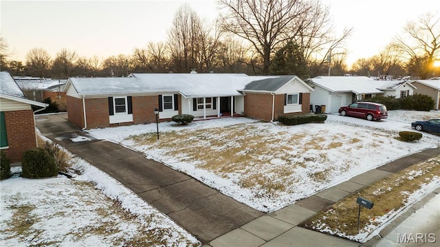 2480 Cambridge Dr, Florissant, MO 63033 - single story home with brick siding, a garage, and a chimney