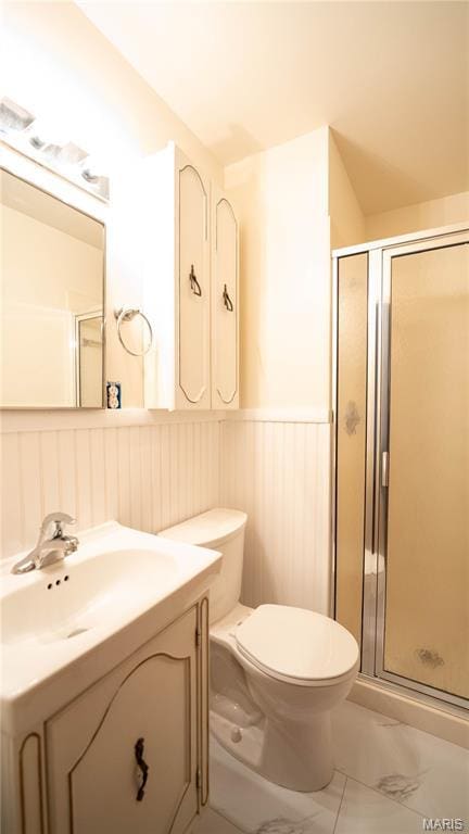 2480 Cambridge Dr, Florissant, MO 63033 - full bathroom featuring a wainscoted wall, vanity, a shower stall, and marble look tiles